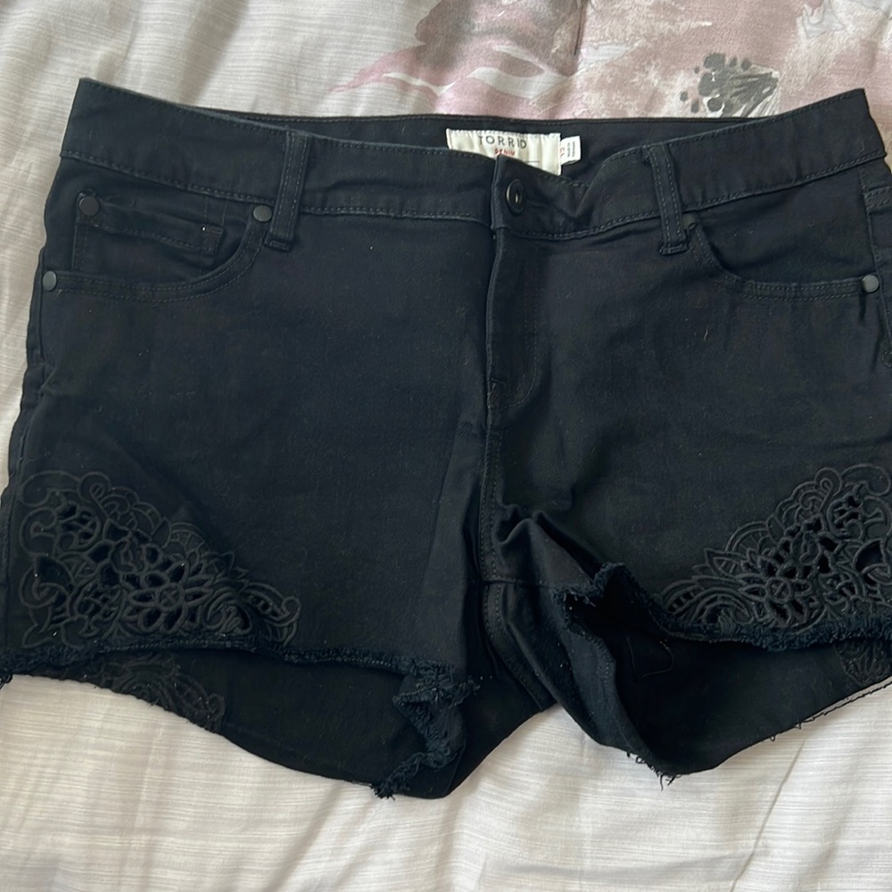 Black torrid jean shorts with cut out detailing